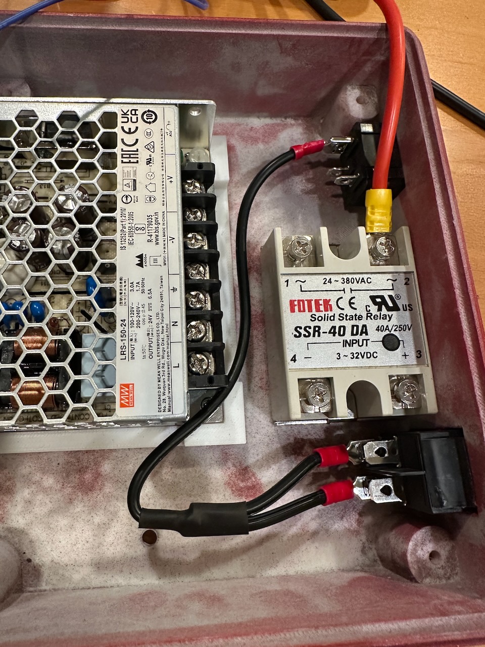 Power supply and solid-state relay mounted in the enclosure